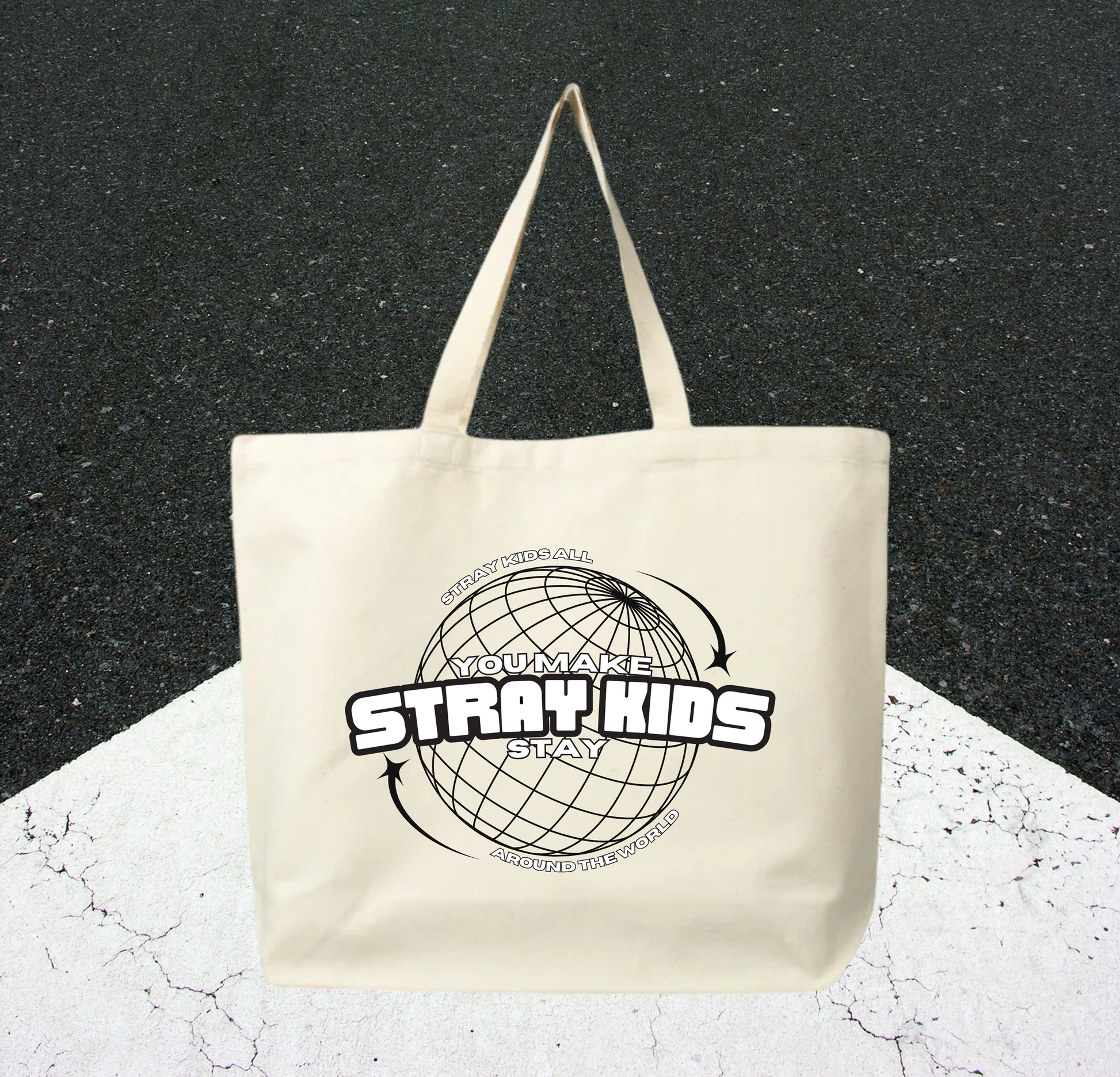 Tote bag with Stray Kids logo on a textured black and white background